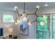 Modern chandelier with multiple lights above main bedroom at 2011 Angier Ave, Durham, NC 27703