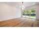 Bright living room with hardwood floors and sliding glass doors at 2011 Angier Ave, Durham, NC 27703