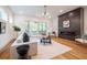 Spacious living room featuring a modern fireplace and hardwood floors at 2011 Angier Ave, Durham, NC 27703