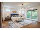 Spacious main bedroom with a king-size bed and private balcony at 2011 Angier Ave, Durham, NC 27703