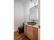 Stylish powder room with a modern floating vanity and dark sink at 2011 Angier Ave, Durham, NC 27703
