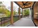 Spacious screened porch with a ceiling fan and backyard access at 2011 Angier Ave, Durham, NC 27703