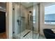 Walk-in shower with geometric tile and frameless glass at 2011 Angier Ave, Durham, NC 27703