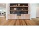 Modern wet bar with floating shelves and a farmhouse sink at 2011 Angier Ave, Durham, NC 27703