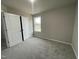 Spacious bedroom with carpet flooring and a large window at 209 Constellation Ct, Benson, NC 27504