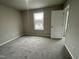 Bright bedroom featuring carpet floors and a window with natural light at 209 Constellation Ct, Benson, NC 27504