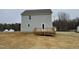 Gray two-story house with deck, in a wooded setting at 209 Constellation Ct, Benson, NC 27504