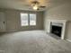 Living room with fireplace and carpet flooring at 209 Constellation Ct, Benson, NC 27504