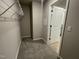 Large walk-in closet with shelving and carpet flooring at 209 Constellation Ct, Benson, NC 27504