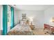 Bedroom with teal curtains and patterned bedding at 2180 Monk Dr, Haw River, NC 27258