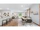 Open concept dining area with hardwood floors and modern table at 2180 Monk Dr, Haw River, NC 27258