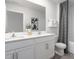 Clean bathroom with double vanity, a bathtub, and gray flooring at 2184 Monk Dr, Haw River, NC 27258