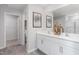 Elegant bathroom with double vanity, large mirror, and walk-in shower at 2184 Monk Dr, Haw River, NC 27258