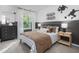 Stylish bedroom with a bed, nightstands, and modern decor at 2184 Monk Dr, Haw River, NC 27258