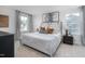 Main bedroom with large bed and neutral color scheme at 2184 Monk Dr, Haw River, NC 27258