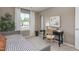 Well-lit bedroom featuring a daybed, desk, and ample natural light at 2184 Monk Dr, Haw River, NC 27258