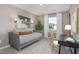 Bright bedroom with built-in desk and daybed, offering versatile functionality at 2184 Monk Dr, Haw River, NC 27258