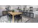 Dining area with light wood table and black chairs near kitchen at 2184 Monk Dr, Haw River, NC 27258