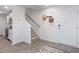 Bright entry with stairs, wood-look floors, and coat rack at 2184 Monk Dr, Haw River, NC 27258