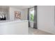 Upstairs hallway with neutral walls and a window at 2184 Monk Dr, Haw River, NC 27258