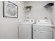 Convenient laundry room equipped with a Whirlpool washer and dryer at 2184 Monk Dr, Haw River, NC 27258