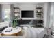 Living room with sectional sofa and built-in shelving at 2184 Monk Dr, Haw River, NC 27258