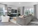 Living room with sectional sofa and built-in shelving at 2184 Monk Dr, Haw River, NC 27258