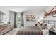 Bright bedroom featuring a plaid comforter and large mirror at 2188 Monk Dr, Haw River, NC 27258