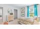 Bedroom with light wood dresser and teal curtains at 2188 Monk Dr, Haw River, NC 27258