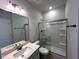 Bathroom featuring vanity with sink, mirror and a glass shower with built-in shelves at 25 Calabria Ct, Franklinton, NC 27525