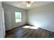 Bright bedroom features hardwood floors, a window view, and neutral paint at 25 Calabria Ct, Franklinton, NC 27525