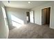 Neutral bedroom with gray carpet, a window, and white doors at 25 Calabria Ct, Franklinton, NC 27525
