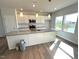 Bright kitchen featuring a large island with a granite countertop, perfect for meal prep and entertaining at 25 Calabria Ct, Franklinton, NC 27525