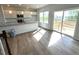Spacious living area with a kitchen, dining area, and sliding glass door access to the outdoors at 25 Calabria Ct, Franklinton, NC 27525