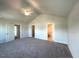 Spacious main bedroom with high ceilings, carpet flooring, and ensuite bathroom access at 25 Calabria Ct, Franklinton, NC 27525