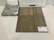Close up of flooring, cabinet, and countertop material samples at 25 Calabria Ct, Franklinton, NC 27525