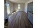 Bright dining area with LVP flooring and door to backyard at 25 Harvest Hills Ln, Dunn, NC 28334