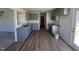 Modern kitchen with gray cabinets, granite counters, and LVP flooring at 25 Harvest Hills Ln, Dunn, NC 28334