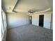 Spacious main bedroom with carpet, ceiling fan, and access to bathroom at 25 Harvest Hills Ln, Dunn, NC 28334