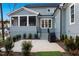 Spacious patio with grill area, landscaping, and screened porch at 2721 Sanctuary Woods Ln, Raleigh, NC 27606