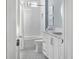 Well-lit bathroom featuring a tub/shower combo, white subway tile, and a stylish vanity with ample storage at 2721 Sanctuary Woods Ln, Raleigh, NC 27606