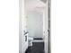Modern bathroom with sleek black and white tile and a glass-enclosed shower at 2721 Sanctuary Woods Ln, Raleigh, NC 27606