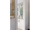 Chic bathroom features a white vanity and an oval mirror at 2721 Sanctuary Woods Ln, Raleigh, NC 27606