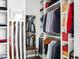 Organized walk-in closet with shelving and hanging space for clothing and accessories at 2721 Sanctuary Woods Ln, Raleigh, NC 27606