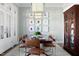 Dining room featuring a large wooden table, seating for eight, modern lighting, and stylish decor, ideal for memorable dinners at 2721 Sanctuary Woods Ln, Raleigh, NC 27606
