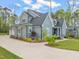 The exterior showcases the home's brickwork, beautiful landscaping, and ample driveway space at 2721 Sanctuary Woods Ln, Raleigh, NC 27606