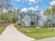 Attractive gray home with a well-kept lawn and beautiful landscaping at 2721 Sanctuary Woods Ln, Raleigh, NC 27606