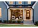 Charming front porch with seating and well-maintained landscaping at 2721 Sanctuary Woods Ln, Raleigh, NC 27606