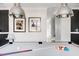 Bright game room featuring a pool table and stylish decor, illuminated by modern pendant lighting at 2721 Sanctuary Woods Ln, Raleigh, NC 27606