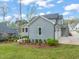 Home features a two car garage, lush landscaping, and hardscaped path at 2721 Sanctuary Woods Ln, Raleigh, NC 27606